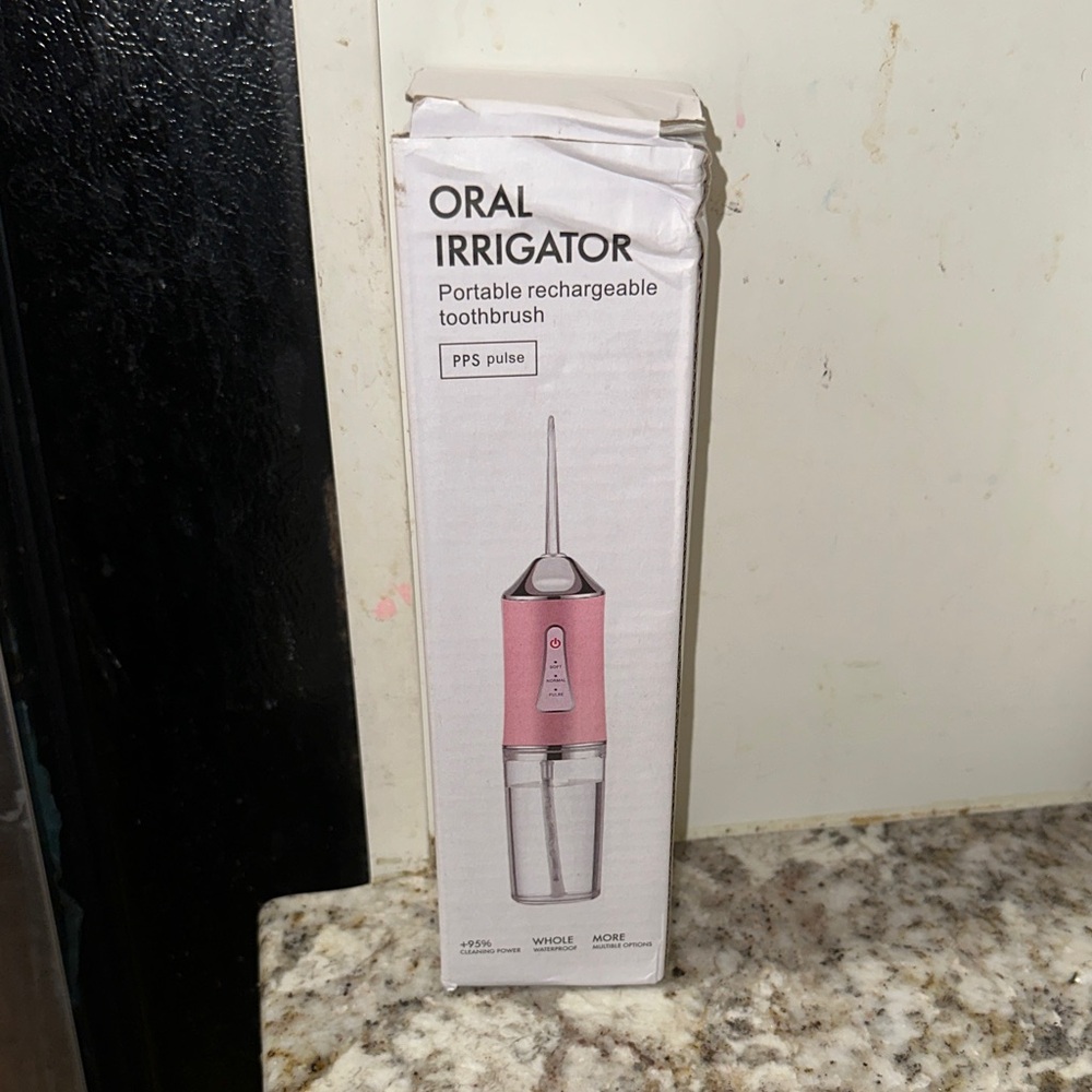 Pink Portable Oral Irrigator